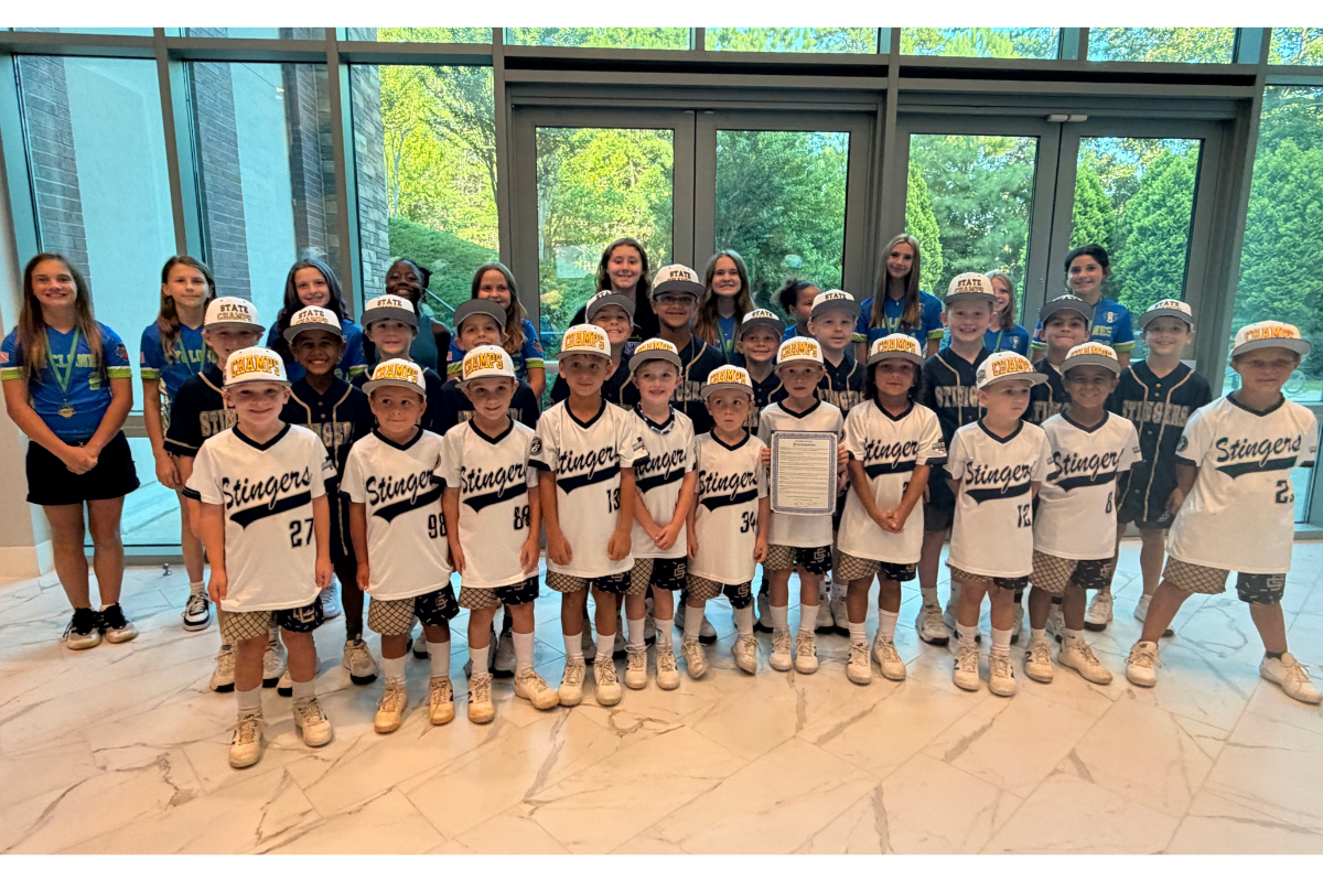 Picture of kids posed with their teammates 